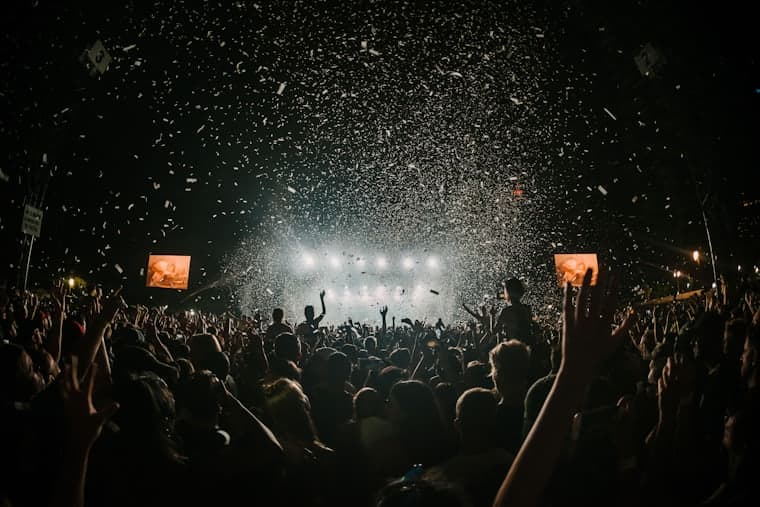 Confetti over a festival crowd at night
