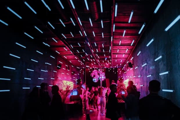 A corridor of pink and blue neon